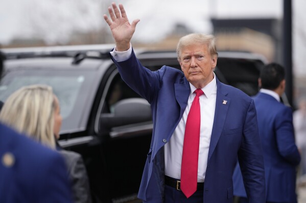 Former President Donald Trump waves to a crowd as he leaves a Commit to Caucus rally, Saturday, Dec. 2, 2023, in Ankeny, Iowa. (APPhoto/Matthew Putney)