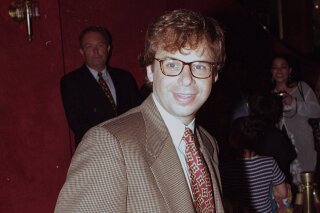 FILE - In this May 1994 file photo, actor Rick Moranis is shown at an unknown location.  A law enforcement official tells the Associated Press that Moranis was sucker punched by an unknown assailant while walking Thursday, Oct. 1, 2020, on a sidewalk near New York’s Central Park.   Moranis took himself to the hospital and later went to a police station to report the incident, according to the official, who was not authorized to speak publicly about the incident and did so on condition of anonymity. (AP Photo/File)