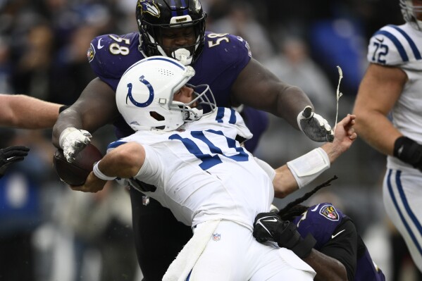 Indianapolis Colts quarterback Gardner Minshew (10) is hit in the end zone for a safety during the second half of an NFL football game against the Baltimore Ravens, Sunday, Sept. 24, 2023, in Baltimore. (AP Photo/Nick Wass)