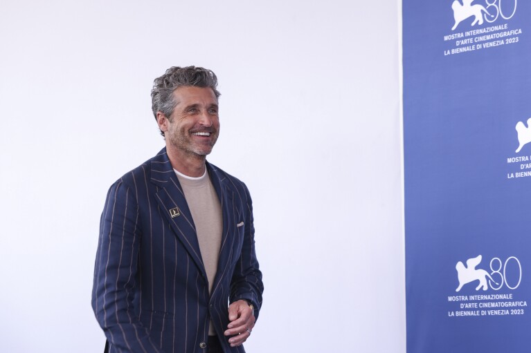 FILE - Patrick Dempsey poses for photographers during the photo call for the film "Ferrari" during the 80th edition of the Venice Film Festival, Aug. 31, 2023, in Venice, Italy. On Tuesday, Nov, 7, People magazine named Dempsey as its Sexiest Man Alive. (Photo by Vianney Le Caer/Invision/AP, File)