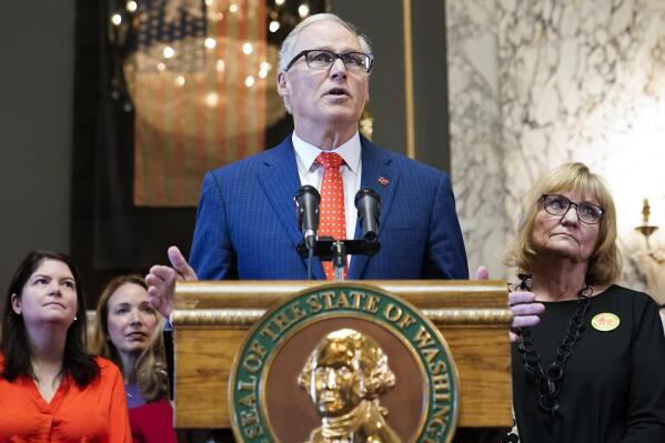 FILE - Washington Gov. Jay Inslee speaks before signing multiple bills meant to prevent gun violence, Tuesday, April 25, 2023, at the Capitol in Olympia, Wash. On Monday, May 1, 2023, Inslee announced he does not plan to seek a fourth term. He was most recently re-elected in 2020, making him only the second Washington state governor to serve three consecutive terms. (AP Photo/Lindsey Wasson, File)
