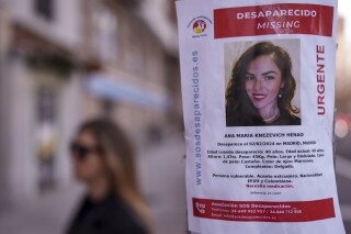 A banner of a Colombian-born American missing woman Ana Maria Knezevich Henao, 40, is displayed on a streetlight in Madrid, Spain, Feb. 16, 2024. The estranged husband of the woman who disappeared three months ago in Spain has been charged by U.S. federal agents with her kidnapping. U.S. marshals arrested David Knezevich at Miami International Airport on Saturday, May 4, 2024. (AP Photo/Manu Fernandez, file)