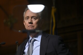 FILE - Connecticut Gov. Ned Lamont looks into a teleprompter as he delivers the State of the State address at the State Capitol, Feb. 7, 2024, in Hartford, Conn.Lamont acknowledged Monday, April 29, 2024, he helped hire a landscaper that illegally chopped down more than 180 trees and thousands of bushes on a property behind his Greenwich home -- capping off days of questions about his level of involvement in the felling. (AP Photo/Jessica Hill, File)