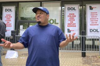 Marcellus Rowe, 29, talks about the prospect of losing federal unemployment aid at a protest outside the Georgia Department of Labor, Thursday, June 24, 2021, in Atlanta. Rowe says he's not sure how he will pay his rent and utilities without the aid. (AP Photo/Jeff Amy)