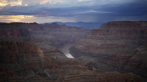 FILE - The Colorado River flows through the Grand Canyon on the Hualapai reservation, Aug. 15, 2022, in northwestern Arizona. Talks that could reshape the way Colorado River water is distributed started on Thursday, June 15, 2023, with a goal of updating and enacting rules in 2027 to continue to provide hydropower, drinking water and irrigation to farms, cities and tribes in seven U.S. states and Mexico. (AP Photo/John Locher, File)