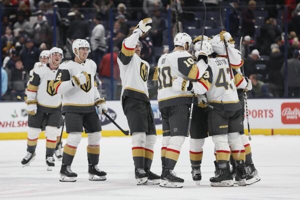 Vegas Golden Knights players celebrate after their win over the Columbus Blue Jackets in an NHL hockey game on Monday, Nov. 28, 2022, in Columbus, Ohio. (AP Photo/Jay LaPrete)