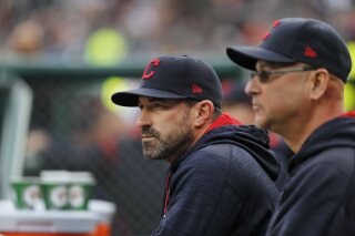 FILE - Cleveland Indians pitching coach Mickey Callaway, left, watches with manager Terry Francona during the first inning of a baseball game against the Detroit Tigers, in Detroit, in this May 3, 2017, file photo. Indians manager Terry Francona said no one in the Cleveland organization “covered up” for former pitching coach Mickey Callaway, who is under investigation by Major League Baseball following allegations of sexual harassment.
In a story Tuesday, March 2, 2021, The Athletic reported that 12 current and former Indians employees have come forward in the last month to say the Indians were aware of Callaway’s inappropriate behavior while he was their pitching coach from 2013-17. (AP Photo/Paul Sancya, File)