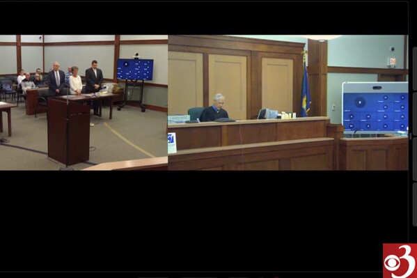 In this screen grab provided by WCAX, Stacey Vaillancourt , left, listens as the judge, right, reads a verdict on Friday, Dec. 1, 2023 in Rutland, Vt. A jury on Friday convicted Vaillancourt of manslaughter and child cruelty in the 2019 death of Harper Rose Briar in Vaillancourt's home. (WCAX via AP)