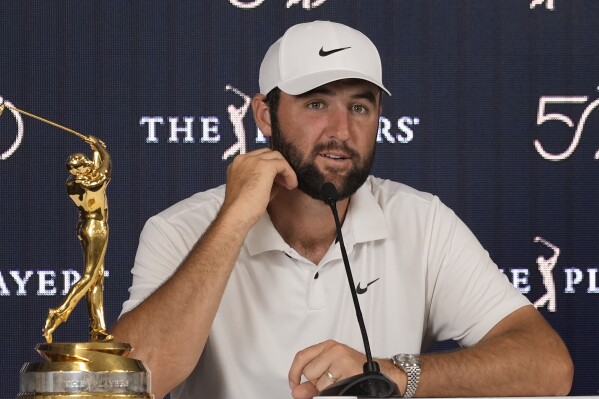 Scottie Scheffler speaks to the media after winning The Players Championship golf tournament Sunday, March 17, 2024, in Ponte Vedra Beach, Fla. (AP Photo/Marta Lavandier)