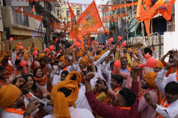 Hindu devotees participate in a religious procession in Hyderabad, India, during the inauguration of a temple dedicated to the Hindu Lord Ram in Ayodhya, Monday, Jan. 22, 2024. Indian Prime Minister Narendra Modi on Monday opened a controversial Hindu temple built on the ruins of a historic mosque in the holy city of Ayodhya in a grand event that is expected to galvanize Hindu voters in upcoming elections. (AP Photo/Mahesh Kumar A.)
