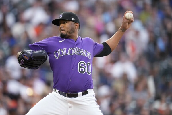Colorado Rockies relief pitcher Fernando Abad works against the Houston Astros during the fourth inning of a baseball game Tuesday, July 18, 2023, in Denver. (AP Photo/David Zalubowski)