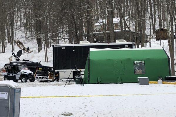 FILE - In this image provided by WJAC-TV, an FBI tent is seen behind police tape at the base of a hill where investigators were conducting an excavation for Civil War-era gold in Dents Run, Pa., March 13, 2018. The FBI was ordered to speed up the release of records about the agency’s 2018 dig for Civil War-era gold in western Pennsylvania by U.S. District Judge Amit P. Mehta on Monday, April 18, 2022. (Bridget McClure/WJAC via AP, File)