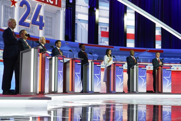 Republican presidential candidates, from left, former Arkansas Gov. Asa Hutchinson, former New Jersey Gov. Chris Christie, former Vice President Mike Pence, Florida Gov. Ron DeSantis, businessman Vivek Ramaswamy, former U.N. Ambassador Nikki Haley, Sen. Tim Scott, R-S.C., and North Dakota Gov. Doug Burgum stand on stage before a Republican presidential primary debate hosted by FOX News Channel Wednesday, Aug. 23, 2023, in Milwaukee. (AP Photo/Morry Gash)