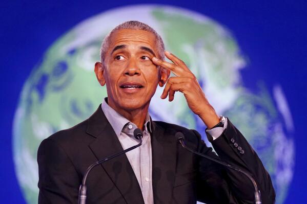 Former U.S. President Barack Obama gestures as he speaks during the COP26 U.N. Climate Summit in Glasgow, Scotland, Monday, Nov. 8, 2021. The U.N. climate summit in Glasgow is entering it’s second week as leaders from around the world, are gathering in Scotland's biggest city, to lay out their vision for addressing the common challenge of global warming.   (Jane Barlow/PA via AP)