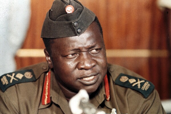 FILE - President Idi Amin of Uganda speaks at a news conference during a visit to Damsacus, Syria, on Oct. 16, 1973. Amin, who took power by force in Uganda in 1971 and ruled until he was removed by armed groups of exiles in 1979, died in Saudi Arabia in 2003. His passing was barely acknowledged in Uganda, and some of Amin's supporters over the years have unsuccessfully lobbied for his remains to be returned home, underscoring his tainted legacy. (AP Photo, File)