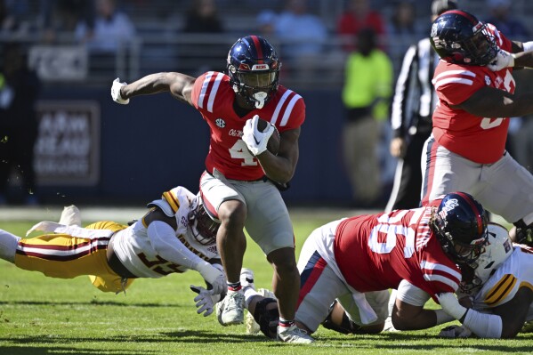 Mississippi running back Quinshon Judkins (4) runs the ball during the first half of an NCAA college football game against Louisiana Monroe in Oxford, Miss., Saturday, Nov. 18, 2023. (AP Photo/Thomas Graning)