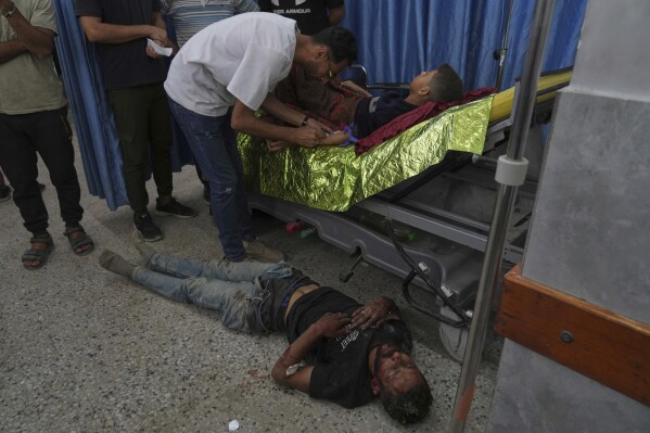 A Palestinian youth, who was injured last night while trying to get access to humanitarian aid, is treated at the al-Shifa Hospital, in Gaza City, Wednesday, June 11, 2025. (AP Photo/Jehad Alshrafi)