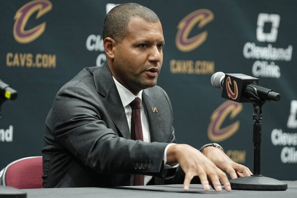 Koby Altman, general manager of the Cleveland Cavaliers, gestures as he speaks at a news conference during an NBA media day, Monday, Oct. 2, 2023, in Cleveland. (AP Photo/Sue Ogrocki)