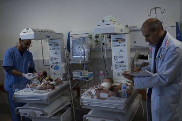 Medics prepare premature babies for transport to Egypt after they were evacuated from Shifa Hospital in Gaza City to a hospital in Rafah, Gaza Strip, Monday, Nov. 20, 2023. (AP Photo/Fatima Shbair)