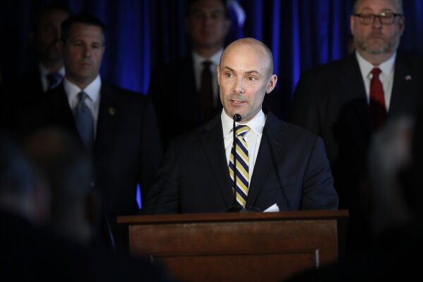 
              DEA Assistant Administration John Martin speaks beside members of Appalachian Regional Prescription Opioid Strike Force, during a news conference, Wednesday, April 17, 2019, in Cincinnati. Federal authorities have charged 60 people, including 31 doctors, for their roles in illegal prescribing and distributing millions of pills with opioids and other dangerous drugs.  (AP Photo/John Minchillo)
            