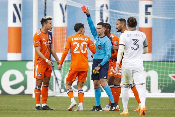 New York City FC midfielder Alfredo Morales, left, receives a red card after a foul against Toronto FC in the second half of an MLS soccer match, Sunday, April 24, 2022, in New York. (AP Photo/Eduardo Munoz Alvarez)