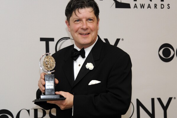 FILE - Michael McGrath poses with his award for best performance by an actor in a featured role in a musical at the 66th annual Tony Awards on Sunday June 10, 2012, in New York. McGrath, a Broadway character actor who shined in zany, feel-good musicals and won a Tony Award for “Nice Work If You Can Get It,” died Thursday at his home in Bloomfield, N.J. He was 65. McGrath was in over a dozen Broadway shows including “Plaza Suite,” “She Loves Me,” “Tootsie” and “Spamalot” as well as on television as the sidekick to Martin Short on “The Martin Short Show.” (Photo by Evan Agostini /Invision/AP, File)