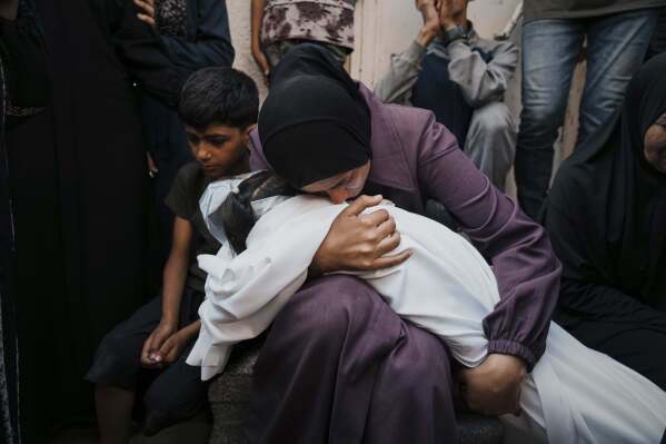 A Palestinian woman mourns as she embraces the body of her daughter Mayar Abu Odeh, 8, who was killed in an Israeli army strike on Gaza. at Al-Shifa Hospital in Gaza City, Wednesday, June 4, 2025. (AP Photo/Jehad Alshrafi)
