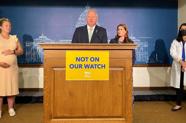Democratic Gov. Tim Walz center, painted Republican challenger Scott Jensen as an extremist at a news conference at the State Capitol in St. Paul, Minn., on Tuesday, June 28, 2022, as he vowed to protect abortion rights in Minnesota. (Trisha Ahmed/Report for America via AP)