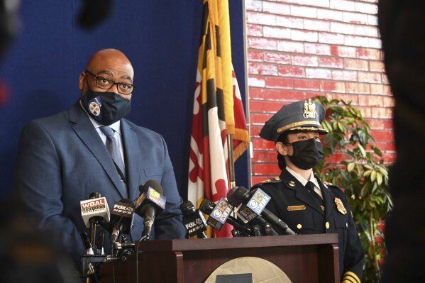 Baltimore County Police Col. Andre Davis, left, and Police Chief Melissa Hyatt are shown at a news conference  in Baltimore County on Monday, March 29, 2021. Investigators have “no idea” why a Maryland man fatally shot his parents at their home and gunned down two other people at a convenience store before setting fire to his apartment and killing himself, a police official said Monday. A gun that Joshua Green, 27, used in Sunday's deadly shooting spree was registered to him and had been legally purchased, according to Baltimore County Police Col. Andre Davis. (Lloyd/The Baltimore Sun via AP)
