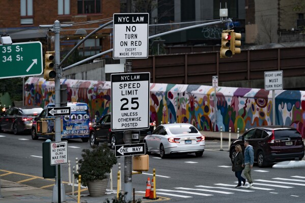 A sign, indicating to drivers that right turns on red are not allowed within city limits, is displayed near the Manhattan exit of the Lincoln Tunnel in New York, Thursday, Nov. 2, 2023. (AP Photo/Peter K. Afriyie)