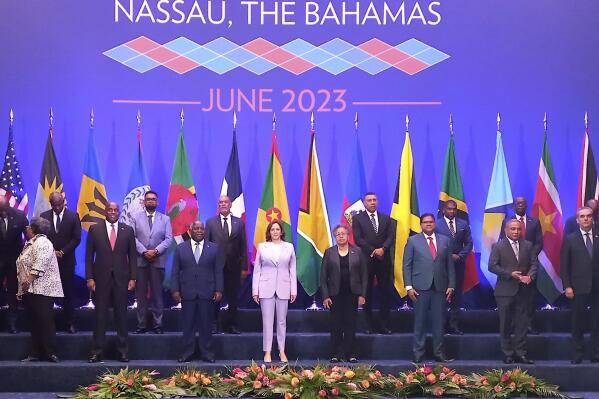 U.S. Vice President Kamala Harris, center, poses for an official group photo with leaders attending the US - Caribbean Leaders meeting, at the Atlantis Conference Center in Nassau, Bahamas, Thursday, June 8, 2023. (AP Photo/Kristaan Ingraham)