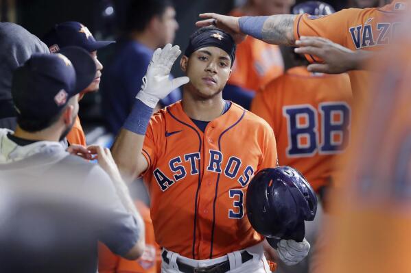 Houston Astros' Jeremy Pena (3) is congratulated in the dugout after his home run against the Los Angeles Angels during the sixth inning of a baseball game Friday, Sept. 9, 2022, in Houston. (AP Photo/Michael Wyke)