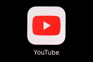 FILE - This March 20, 2018, file photo shows the YouTube app on an iPad in Baltimore. YouTube is rolling out new rules for AI content, Tuesday, Nov. 14, 2023, including requiring creators to reveal whether they've used generative artificial intelligence to make realistic looking videos. (AP Photo/Patrick Semansky, File)