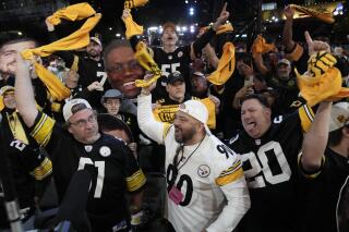 Pittsburgh Steelers fans cheer during the first round of the NFL football draft, Thursday, April 27, 2023, in Kansas City, Mo. (AP Photo/Charlie Riedel)