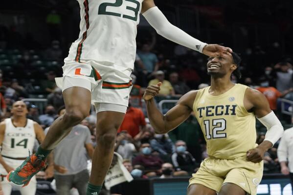 Miami guard Kameron McGusty (23) goes p for a shot against Georgia Tech forward Khalid Moore (12) during the second half of an NCAA college basketball game, Wednesday, Feb. 9, 2022, in Coral Gables, Fla. (AP Photo/Wilfredo Lee)