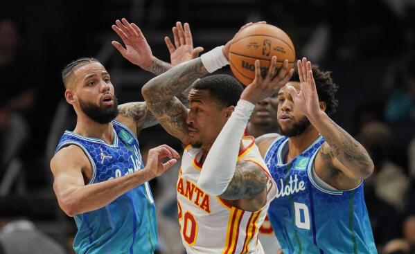 Young scores 30, Hawks hammer cold-shooting Hornets 113-91
