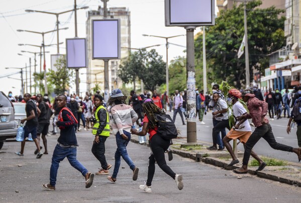 Protesters disperse as police deploy in Maputo, Mozambique, Thursday, Nov. 7, 2024. Protesters dispute the outcome of the Oct. 9 elections, which saw the ruling Frelimo party extend its 49-year rule. (AP Photo/Carlos Uqueio, File)