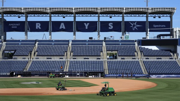 Tampa Bay Rays grounds crew members prepare the field at George M. Steinbrenner Field during a stadium tour Wednesday, March 26, 2025, in Tampa, Fla. (AP Photo/Chris O'Meara)