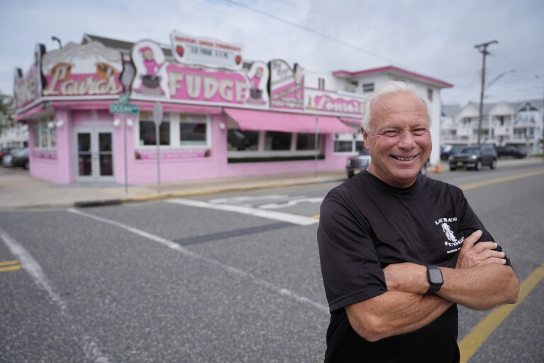 Dave Roach, owner of Laura's Fudge, poses for a photograph outside his store in Wildwood, N.J., Friday, Aug. 9, 2024. (AP Photo/Matt Rourke)