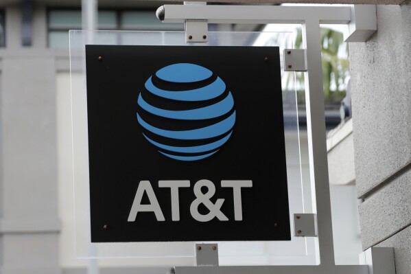 FILE - The sign in front of an AT&T retail store is seen in Miami, July 18, 2019. The theft of sensitive information belonging to millions of AT&T’s current and former customers has been recently discovered online, the telecommunications giant said Saturday, March 30, 2024. In an announcement addressing the data breach, AT&T said that a dataset found on the dark web contains information including some Social Security numbers and passcodes for about 7.6 million current account holders and 65.4 million former account holders. (AP Photo/Lynne Sladky, File)