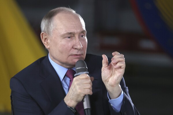 Russian President Vladimir Putin speaks to students and employees of the Chelyabinsk Forge-and-Press Plant in Chelyabinsk, Russia, Friday, Feb. 16, 2024. (Alexander Ryumin, Sputnik, Kremlin Pool Photo via AP)