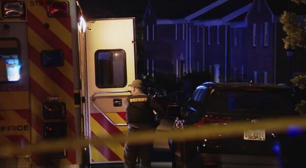 Law enforcement respond to a deadly shooting at a town house complex in Spotsylvania County, Va., on Tuesday, April 8, 2025. (WJLA-TV via AP)