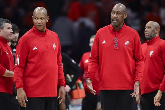 FILE - Louisville head coach Kenny Payne, left, and associate head coach Danny Manning during the second half of an NCAA college basketball game against Syracuse in Syracuse, N.Y., Wednesday, Feb. 7, 2024. Colorado coach Tad Boyle is adding basketball great Danny Manning to his coaching staff in a reunion of the former Kansas teammates. Boyle and Manning spent a season together with the Jayhawks in 1984-85. (AP Photo/Adrian Kraus, File)