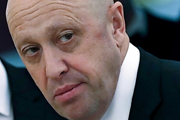 FILE - Russian businessman Yevgeny Prigozhin is shown prior to a meeting of Russian President Vladimir Putin and Chinese President Xi Jinping in the Kremlin in Moscow, Russia, on July 4, 2017. A business jet en route from Moscow to St. Petersburg crashed Wednesday Aug. 23, 2023, killing all ten people on board, Russian emergency officials said. Mercenary chief Yevgeny Prigozhin was on the passenger list, officials said, but it wasn't immediately clear if he was on board. (Sergei Ilnitsky/Pool via AP, File)