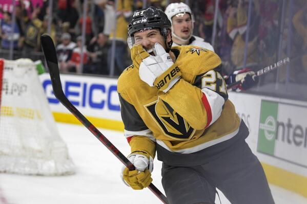 Vegas Golden Knights defenseman Shea Theodore (27) reacts after scoring in overtime against the Washington Capitals during an NHL game Wednesday, April 20, 2022, in Las Vegas. The Golden Knights won 4-3. (AP Photo/Sam Morris)