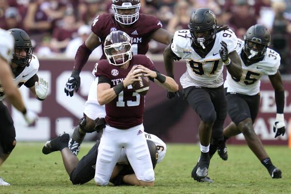 Texas A&M quarterback Haynes King (13) is tackled for no gain by Appalachian State linebacker Nick Hampton (9) during the first half of an NCAA college football game Saturday, Sept. 10, 2022, in College Station,Texas. (AP Photo/Sam Craft)