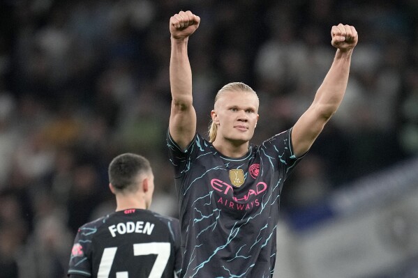 Manchester City's Erling Haaland celebrates scoring his side's first goal during the English Premier League soccer match between Tottenham Hotspur and Manchester City at Tottenham Hotspur Stadium in London, Tuesday, May 14, 2024.(AP Photo/Kin Cheung)