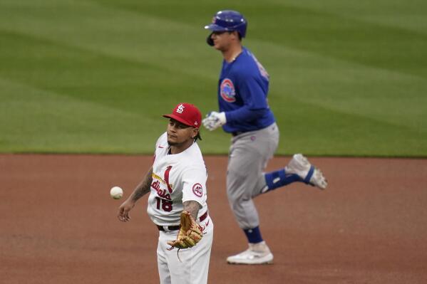St. Louis Cardinals starting pitcher Carlos Martinez, left, gets a new ball as Chicago Cubs' Joc Pederson rounds the bases after hitting a solo home run during the first inning of a baseball game Friday, May 21, 2021, in St. Louis. (AP Photo/Jeff Roberson)