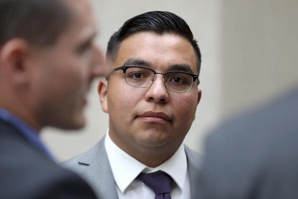 FILE - In this May 30, 2017, file photo, St. Anthony police officer Jeronimo Yanez stands outside the Ramsey County Courthouse while waiting for a ride in St. Paul, Minn. Closing arguments are set for Monday, June 12, in a Minnesota police officer’s manslaughter trial in the death of a black motorist. (David Joles/Star Tribune via AP, File)