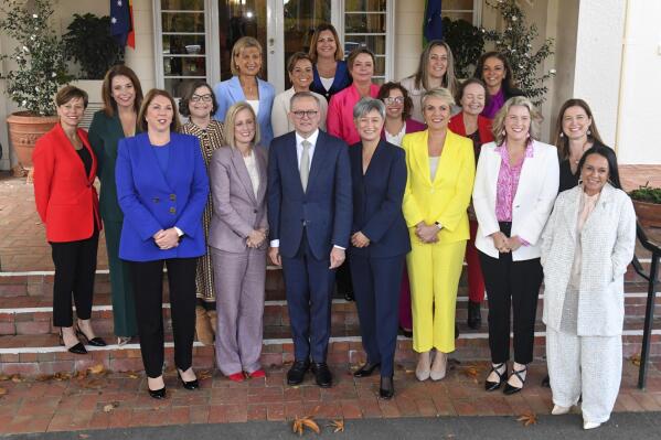 Australian Prime Minister Anthony Albanese, front center, and his ministers pose for a group photo after their swearing-in ceremony at Government House in Canberra, Australia, Wednesday, June 1, 2022. Australia's new cabinet was sworn in at the nation's capital on Wednesday with a record number of women in ministerial roles, including the country's first ever Muslim ministers. (Mick Tsikas/AAP Image via AP)